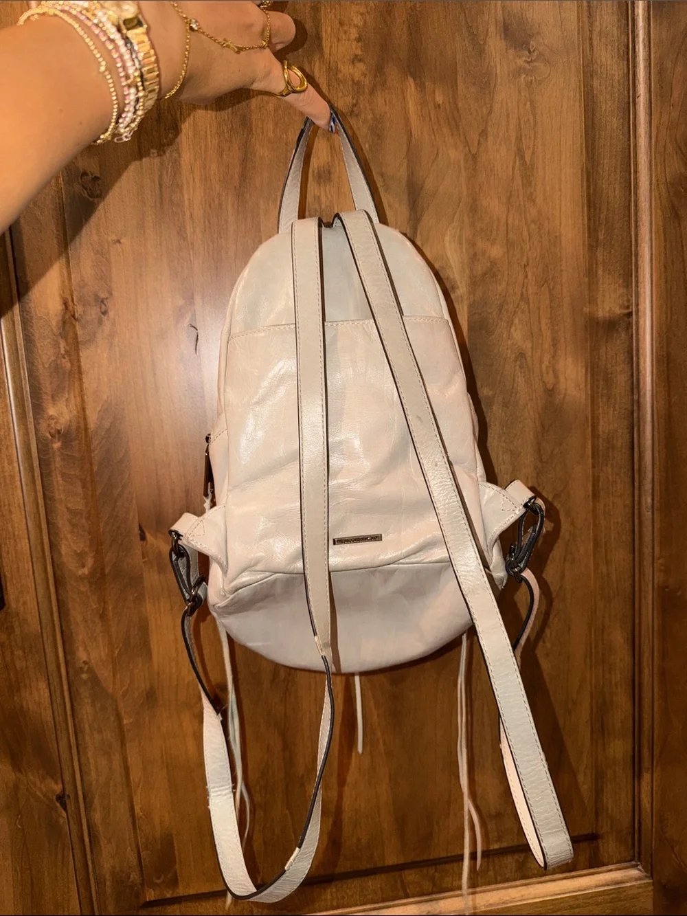 Rebecca Minkoff Ivory Leather Backpack with Gunmetal Hardware slightly worn.